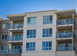Brand new apartment building on sunny day in BC, Canada. Architectural details of modern apartment building
