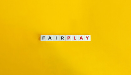 Fair Play Idiom on Block Letter Tiles on Yellow Background. Minimal Aesthetics. - obrazy, fototapety, plakaty