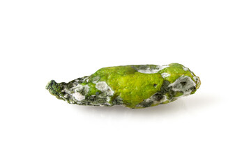 Spoiled and rotten cucumber on white background, fungus with mold on vegetable. A food product that...