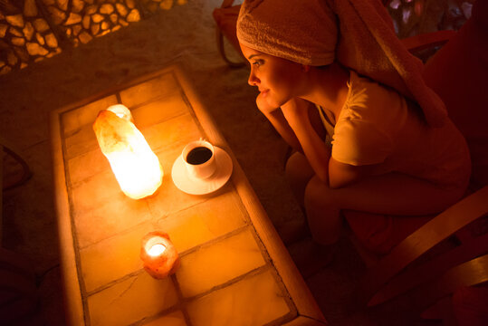 Beautiful woman enjoying salt therapy and beauty treatment in beauty spa