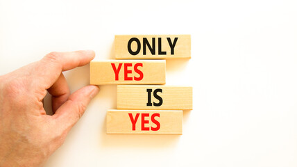 Only yes is yes symbol. Concept words Only yes is yes on wooden blocks on a beautiful white table white background. Businessman hand. Business, psychological only yes is yes concept.