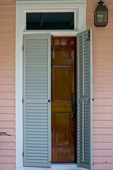 Key West wooden doorway with transom and shutters