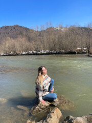 Girl Sitting on the Lake Rock 3