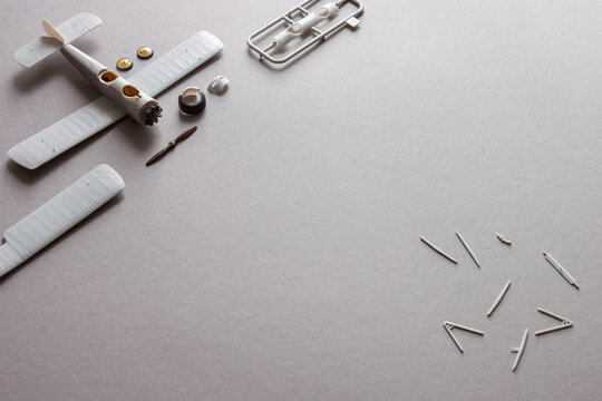 Scale model of the airplane fighter with details. Plastic assembly kit. Top view. Copy space