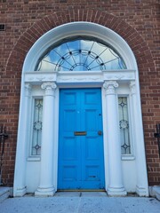 Fototapeta na wymiar Blue georgian door in Dublin, example of typical architecture of Dublin, Ireland