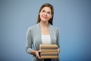 Smiling student girl with books looking side way isolated portrait.