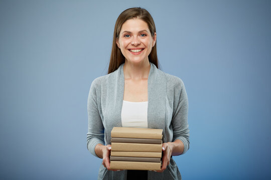 Happy student girl with books isolated portrait on blue.