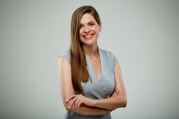 Smiling business woman with arms crossed. isolated portrait.