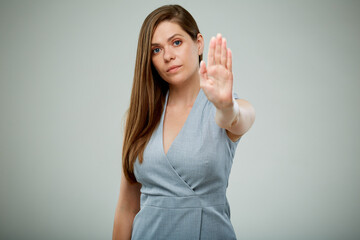 Business woman gesturing stop with hands. isolated female portrait.