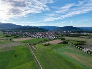 Panoramic aerial drone view on the village of Soultz-Haut-Rhin near Guebwiller, in the Florival valley, on a sunny summer day