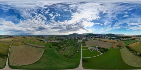 360 panoramic aerial drone view of fields and roads near Soultz-Haut-Rhin in Alsace plain at...