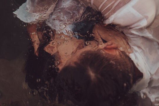 Romantic couple kissing under water. High quality photo