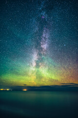 Milky Way over the north sea with aurora borealis. High quality photo