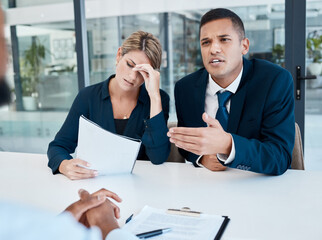 Lawyer talking in an office while stress client read document while talking to company CEO or boss,...
