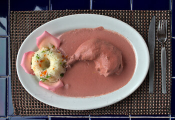 Typical Mexican dish mole rosa with rice