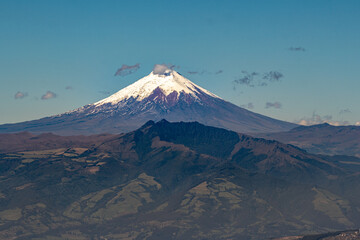 Fototapeta premium Majestic Cotopaxi volcano seen on a summer morning from the city of Quito.