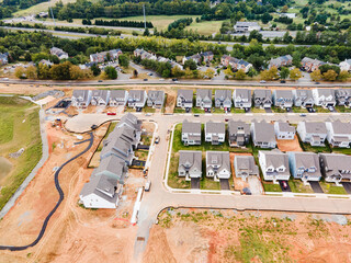 Construction site with new houses and prepared place for construction.