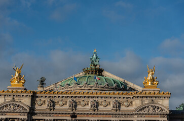 Music on top of Opera Garnier Winged golden statues atop the paris opera house paris