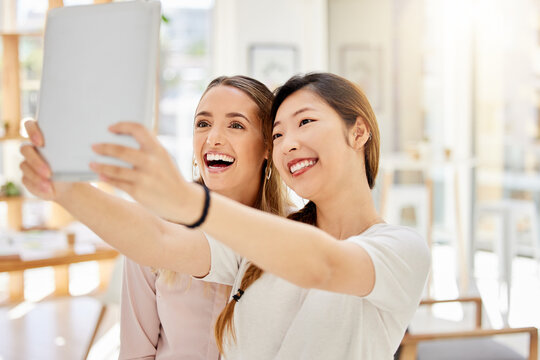 Tablet, happy and women taking a selfie at work on a break to post it on social media on a network app. Smile, friends and business people on a fun online video call about a digital startup agency