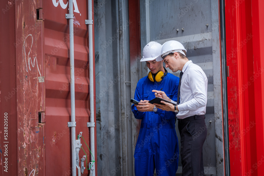 Poster Manager and worker working checking stock into container for loading,Logistic and business export.