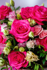 Natural background with raspberry rose and lisianthus