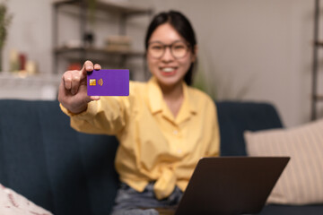 Asian Lady Showing Credit Card Shopping Via Laptop At Home