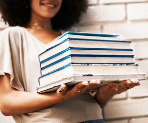 Education, knowledge and learning student with books for studying, research or assignment on a...