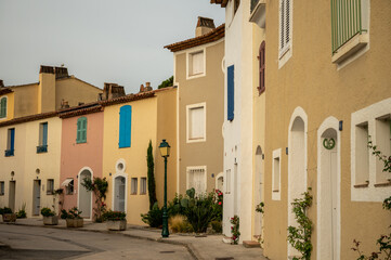 Fototapeta na wymiar Colorful houses in Port Grimaud, village on Mediterranean sea with yacht harbour, Provence, France