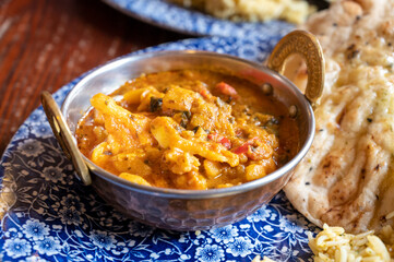 Indian style food, vegetarian curry dish served with rice and garlic bread naan