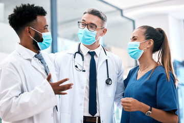 Doctor, nurse and covid with a team of healthcare or medical workers working together in collaboration in a hospital. Mask, teamwork and insurance with professional medicare personnel in a clinic