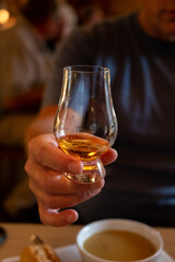 Tasting of single malt scotch whisky in whiskey bar in Edinburgh, UK