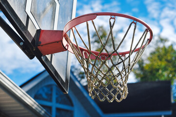 Selective focus of portable basketball system in front of house for kids to playing at home. © VisualArtStudio