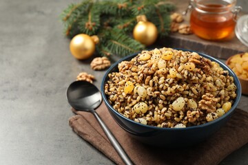 Traditional Christmas slavic dish kutia served on grey table, closeup. Space for text