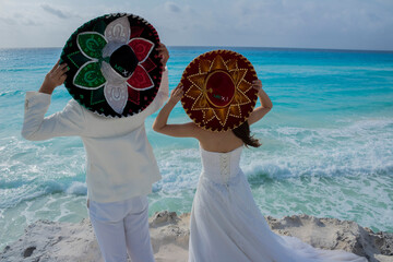 Wedding couple are modeling some mexican charro hat