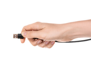 A woman's hand holds a cable with a usb connector. The concept of connecting a computer device. Isolated on white background.