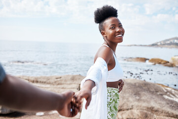 Summer, sea and smile, a black couple holding hands and walking on the beach. Nature, love and...