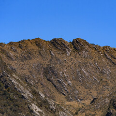 Rocky montains with frailejones close to San Pedro de Iguaque in Colombia on a beautiful blue sky day.