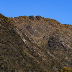Rocky montains with frailejones close to San Pedro de Iguaque in Colombia on a beautiful blue sky day.