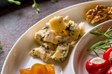cheese Dor blue on white plate macro close up,cubes