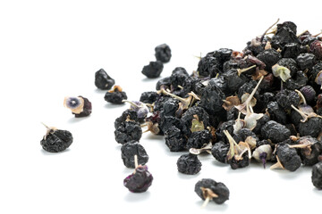 Close-up ov black Chinese wolfberry on white background
