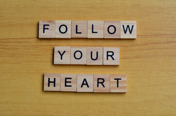 follow your heart text on wooden square, inspiration quotes