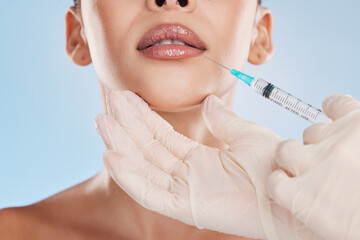 Beauty, collagen and a woman getting a lip injection from a medical worker. Plastic surgery, dermal...
