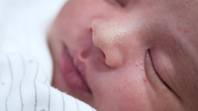 Close Up Portrait Of Sleeping New Born Indian Baby Boy Showing Small Dimples On Nose. Slow Motion