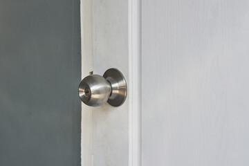 door handle and lock on white door