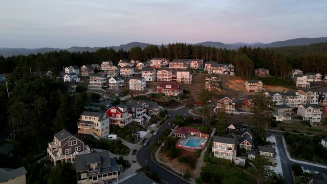 Aerial shot of small beach town at sunset.
