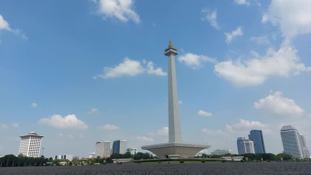 JAKARTA, INDONESIA - September 6, 2022: Time lapse of the National Monument or also known as Monas which is located in Jakarta, the capital city of Indonesia, recorded in 4k resolution.