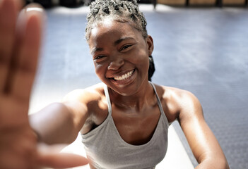 Fitness, happy and black woman taking a selfie in the gym after training, exercise and workout...