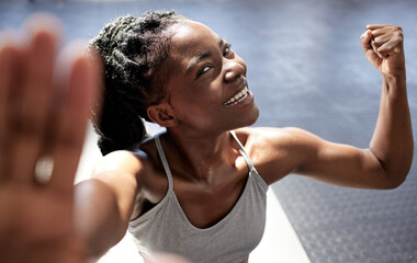 Fitness motivation, strong muscle and workout woman from Jamaica happy after a gym exercise. Selfie of a athlete with a smile before training, boxing and sports wellness exercise with a fist