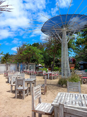 tables and chairs on the beach restaurant