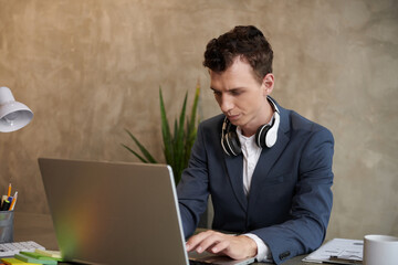 Serious Businessman Working on Laptop